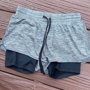 Athletic shorts with sewn in spandex